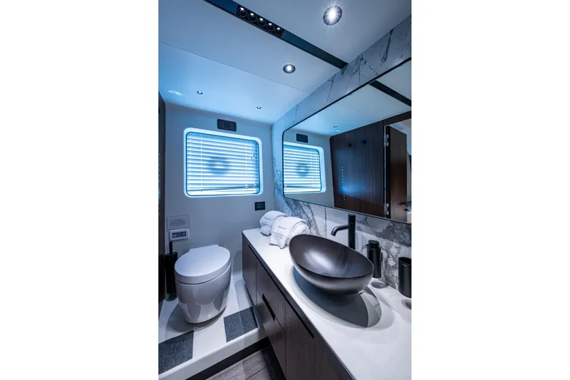 Alamar Yacht Photos Pics Luxurious 2023 Astondoa AS5 yacht bathroom with modern fixtures and elegant design.