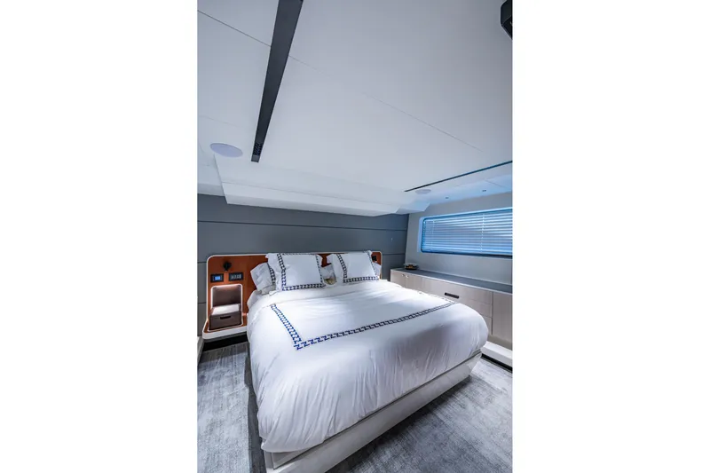 Alamar Yacht Photos Pics Luxurious bedroom interior of 2023 Astondoa AS5 yacht with modern design.