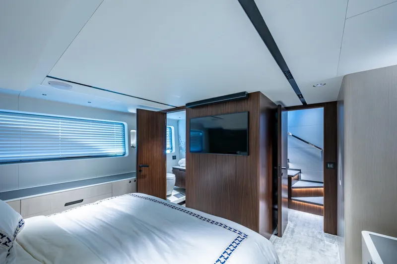 Alamar Yacht Photos Pics Luxurious 2023 Astondoa AS5 yacht bedroom with modern design and elegant wood finishes.