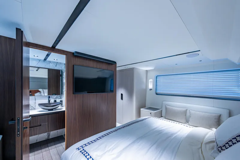 Alamar Yacht Photos Pics Luxurious 2023 Astondoa AS5 yacht bedroom with modern design and elegant furnishings.