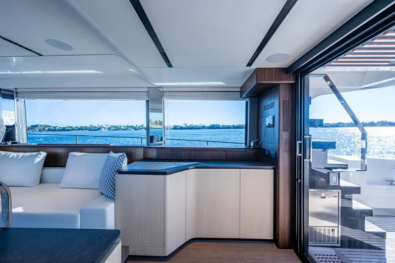 Alamar Yacht Photos Pics Luxurious interior of 2023 Astondoa AS5 yacht with ocean view and modern design.
