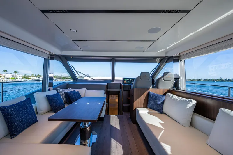 Alamar Yacht Photos Pics Luxurious interior of 2023 Astondoa AS5 yacht with elegant seating and scenic ocean views.