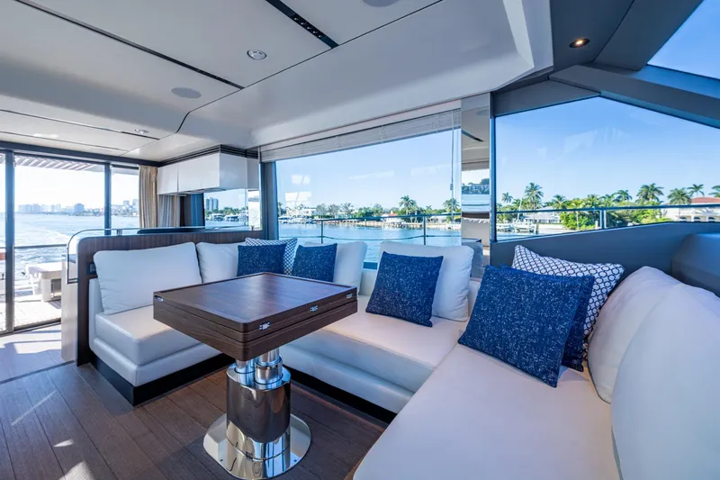 Alamar Yacht Photos Pics Luxurious interior of 2023 Astondoa AS5 yacht with elegant seating and scenic ocean views.