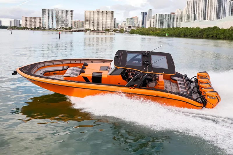  Yacht Photos Pics 2023 Midnight Express 43' Solstice boat cruising on a calm urban waterway.