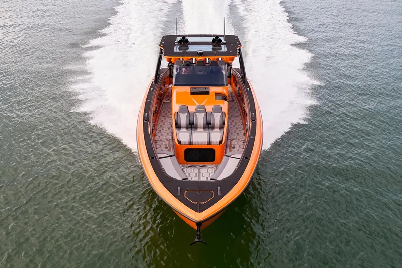  Yacht Photos Pics 2023 Midnight Express 43' Solstice boat cruising on open water, aerial view.