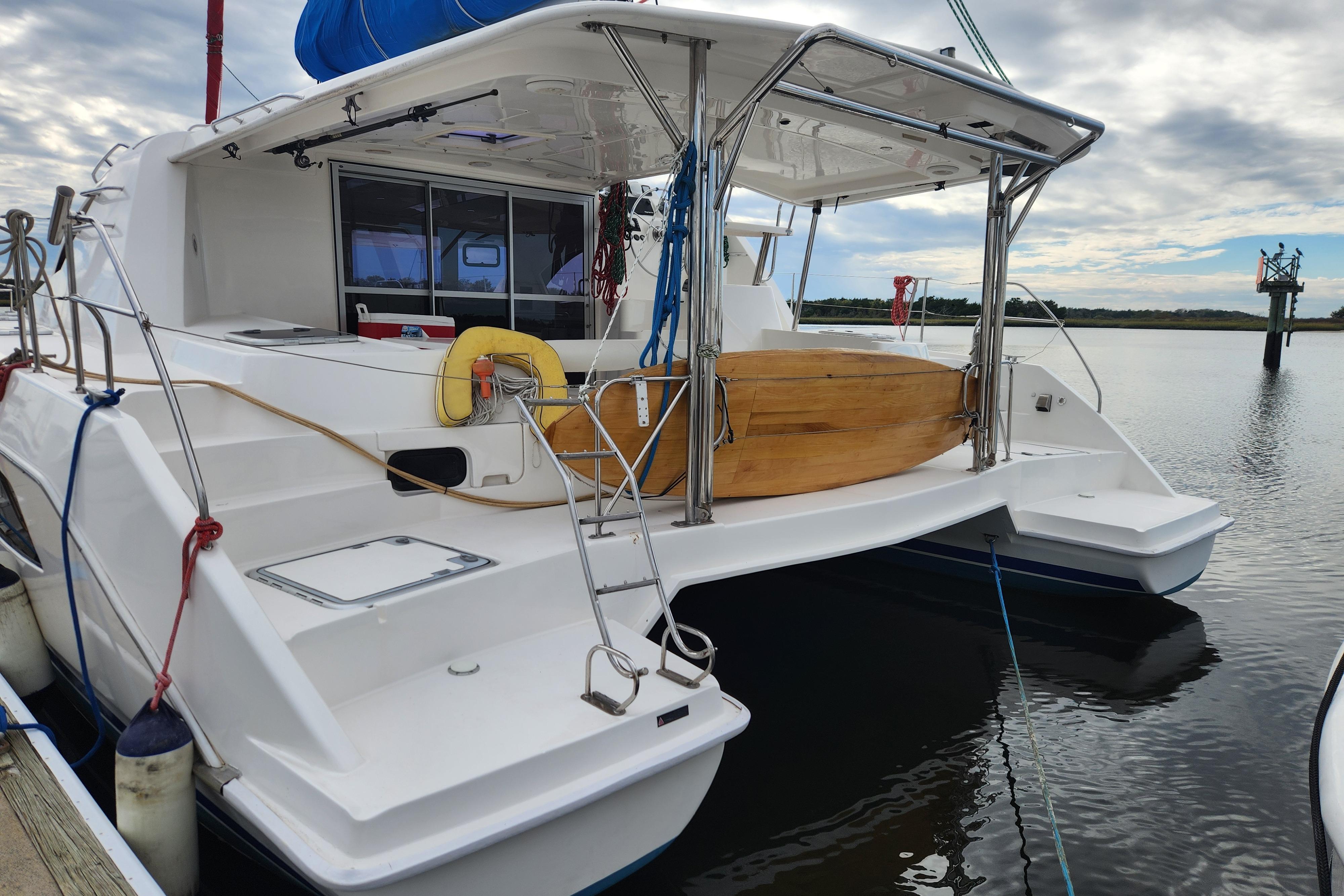 Leopard 44 catamaran, 2015 model, docked with clear skies and calm waters.