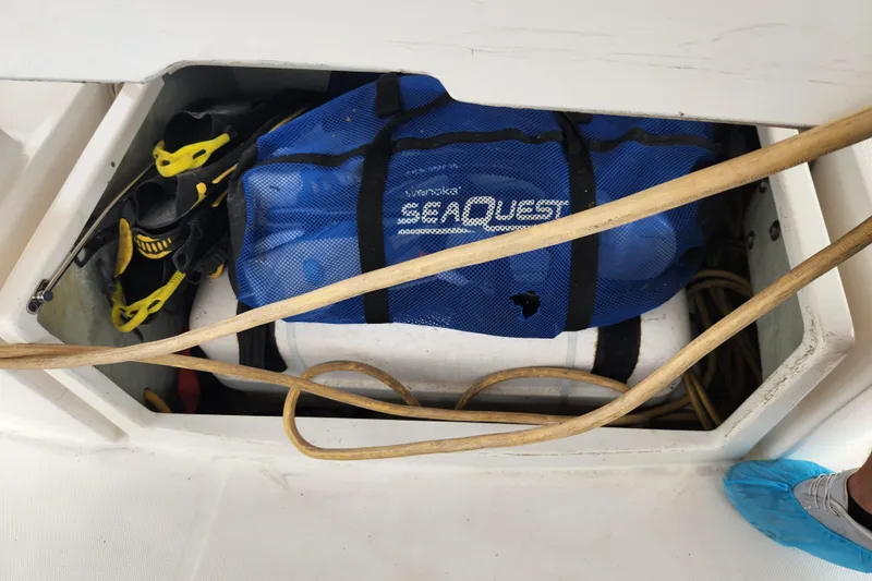 Cara Lynn Yacht Photos Pics Storage compartment on Leopard 44 boat with diving gear and blue bag, 2015 model.