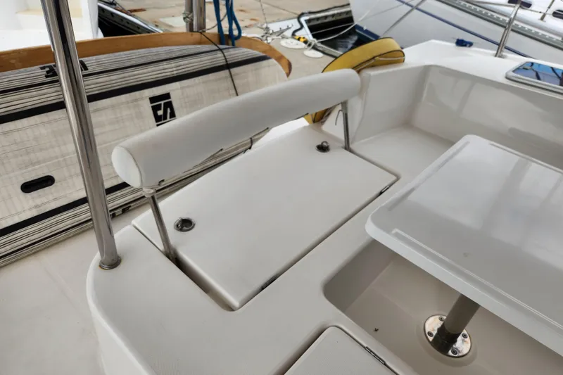 Cara Lynn Yacht Photos Pics Leopard 44 catamaran cockpit with seating and table, showcasing modern design and functionality.