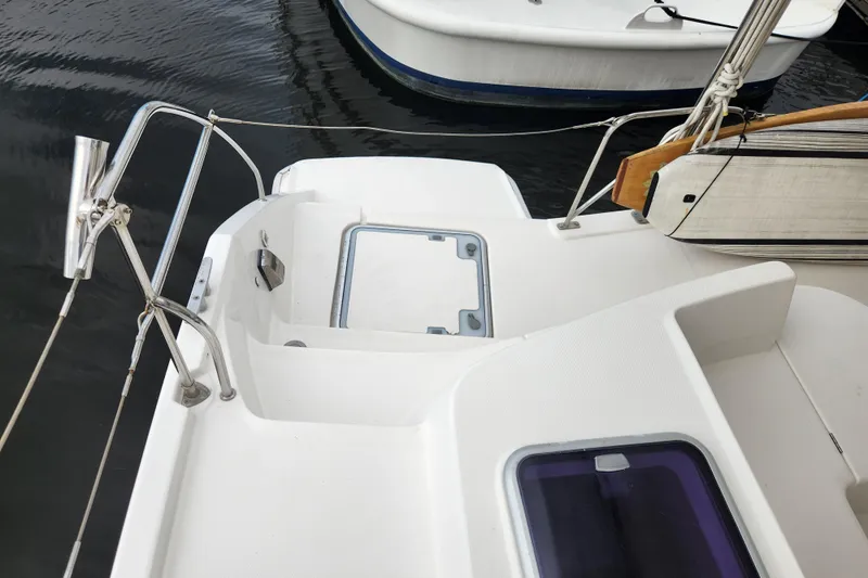 Cara Lynn Yacht Photos Pics Stern view of a 2015 Leopard 44 catamaran docked at a marina.