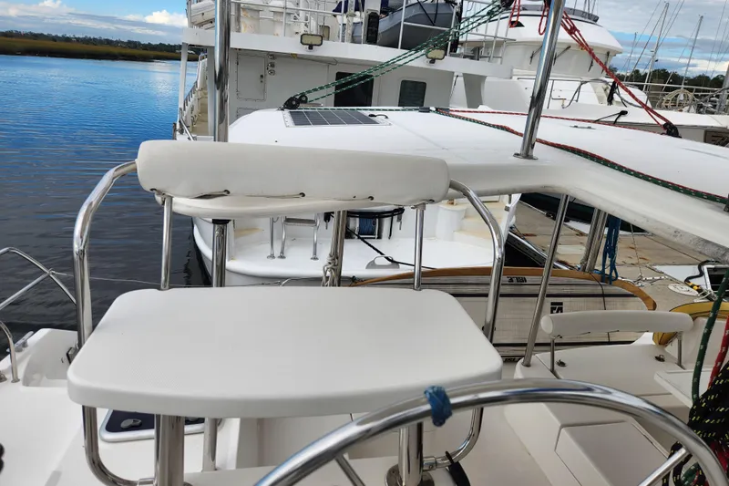 Cara Lynn Yacht Photos Pics Helm station of a 2015 Leopard 44 catamaran docked at a marina.