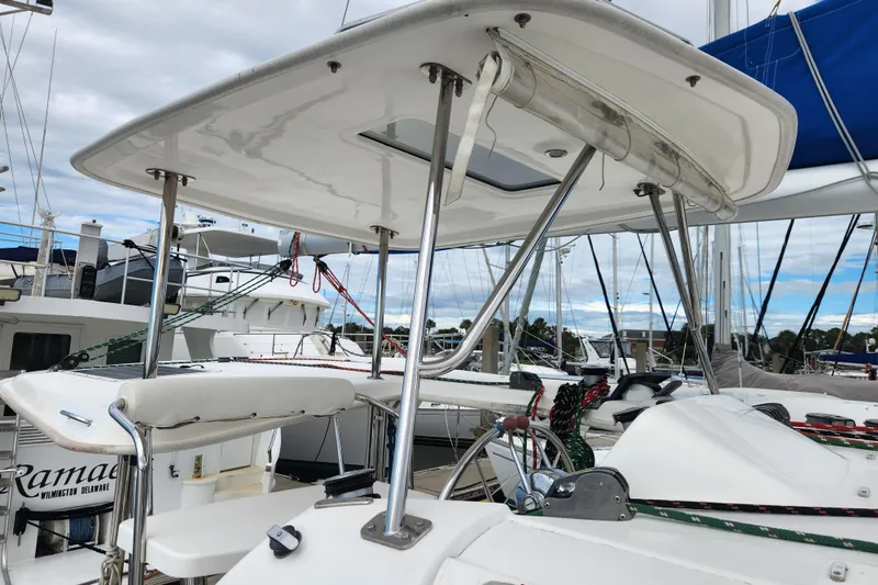 Cara Lynn Yacht Photos Pics Sailing yacht Leopard 44, 2015 model, docked at marina with clear sky background.