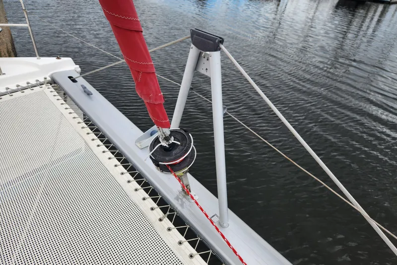 Cara Lynn Yacht Photos Pics Leopard 44 catamaran deck with red sail and rigging, 2015 model.