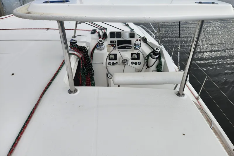 Cara Lynn Yacht Photos Pics Helm of 2015 Leopard 44 catamaran with navigation equipment and ropes.