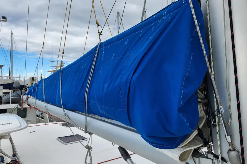 Cara Lynn Yacht Photos Pics Blue sail cover on a 2015 Leopard 44 catamaran, docked with other boats.