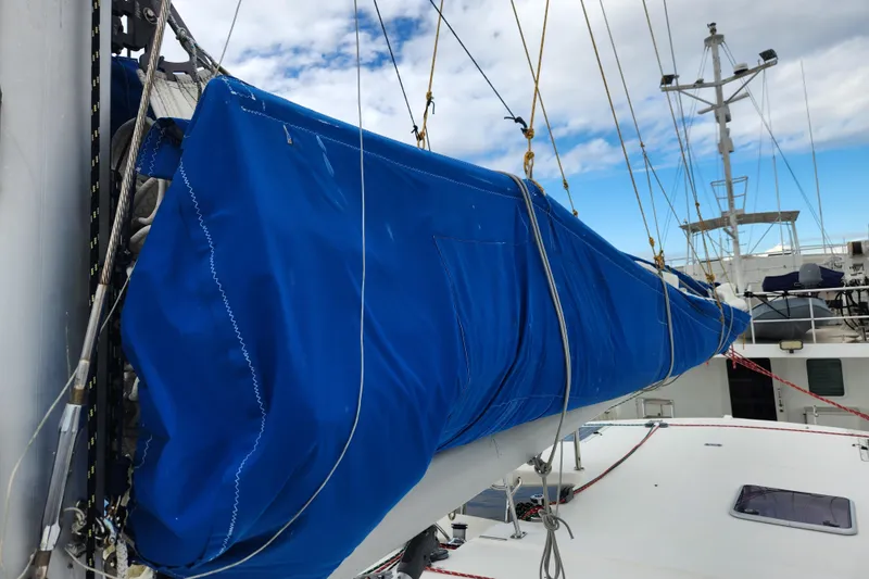 Cara Lynn Yacht Photos Pics 2015 Leopard 44 sailboat with blue sail cover on deck.