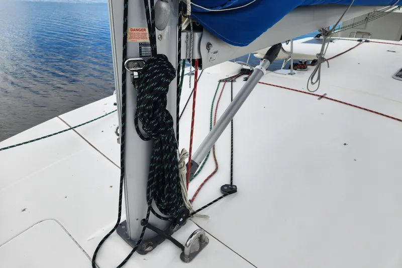 Cara Lynn Yacht Photos Pics 2015 Leopard 44 sailboat deck with rigging and ropes by the water.