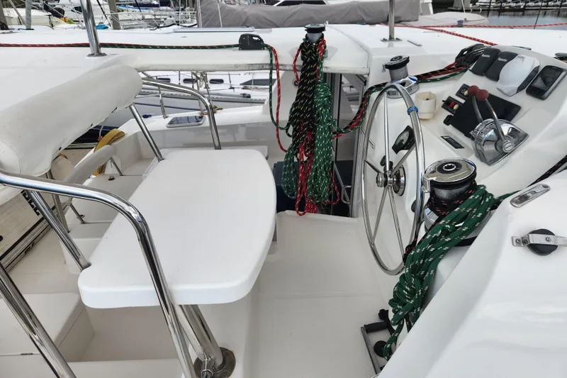 Cara Lynn Yacht Photos Pics Cockpit of 2015 Leopard 44 yacht with steering wheel and ropes.