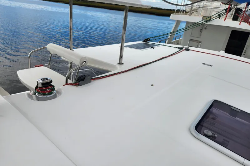 Cara Lynn Yacht Photos Pics 2015 Leopard 44 catamaran deck with winch and ropes by the water.