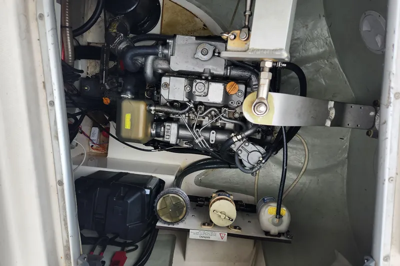 Cara Lynn Yacht Photos Pics Engine compartment of a 2015 Leopard 44 catamaran, showcasing mechanical components and wiring.