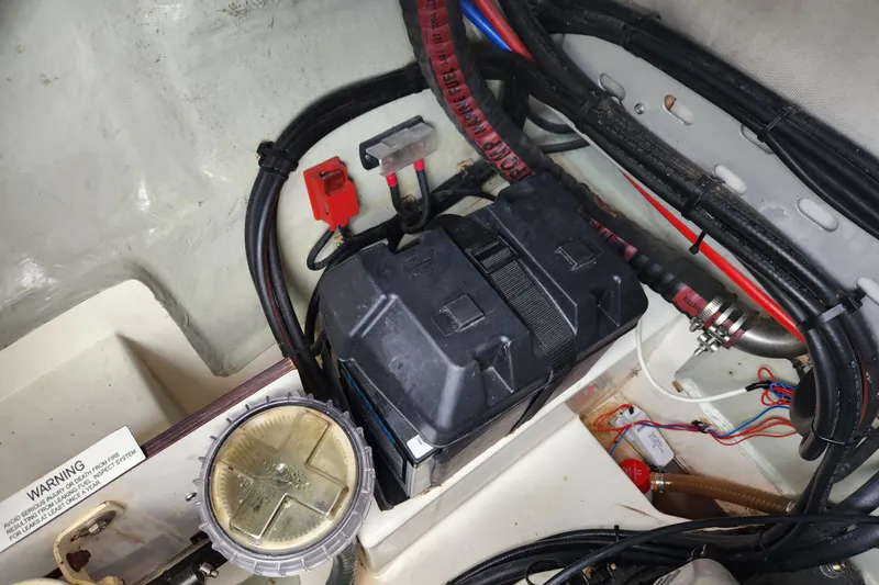 Cara Lynn Yacht Photos Pics Battery compartment of a 2015 Leopard 44 boat with wiring and components.