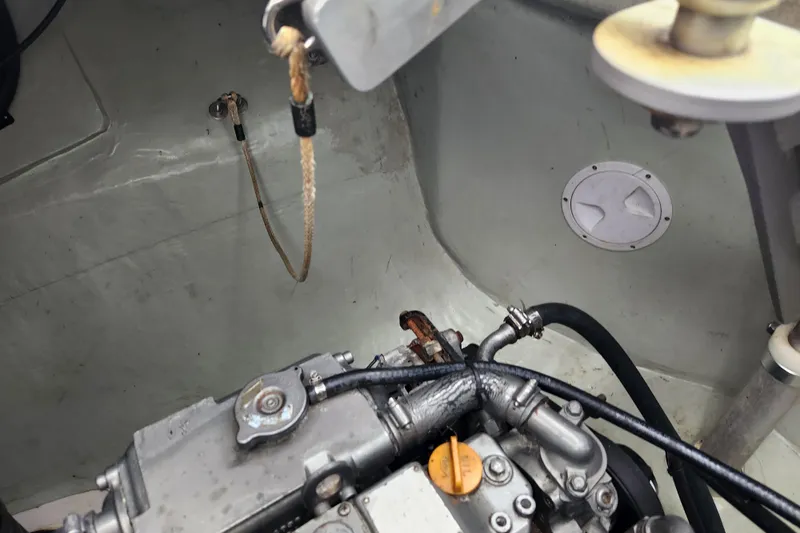 Cara Lynn Yacht Photos Pics Engine compartment of a 2015 Leopard 44 boat, showing mechanical components and hoses.