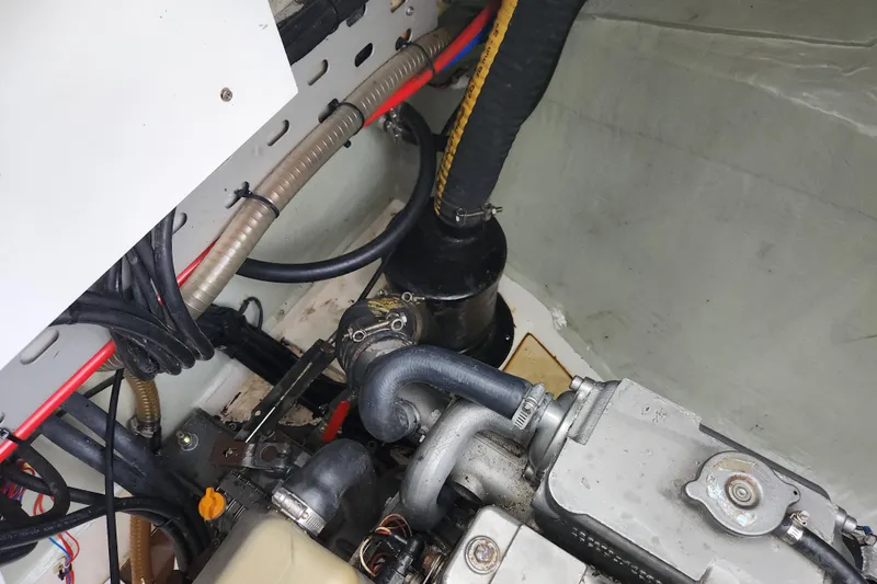 Cara Lynn Yacht Photos Pics Engine compartment of a 2015 Leopard 44 yacht, showing hoses and mechanical components.