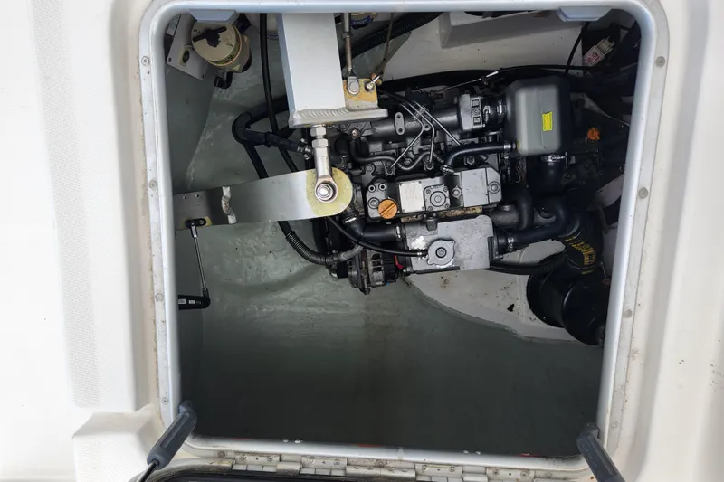 Cara Lynn Yacht Photos Pics Engine compartment of a 2015 Leopard 44 catamaran, showcasing mechanical components and systems.