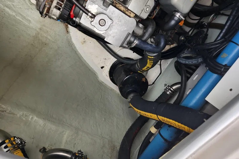 Cara Lynn Yacht Photos Pics Engine compartment of a 2015 Leopard 44 boat with visible hoses and components.
