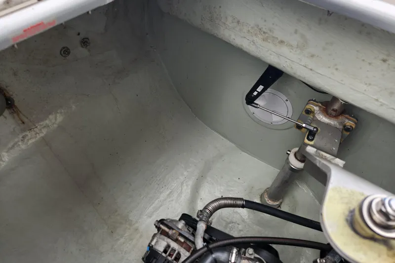 Cara Lynn Yacht Photos Pics Engine compartment of a 2015 Leopard 44 boat, showing mechanical components and wiring.