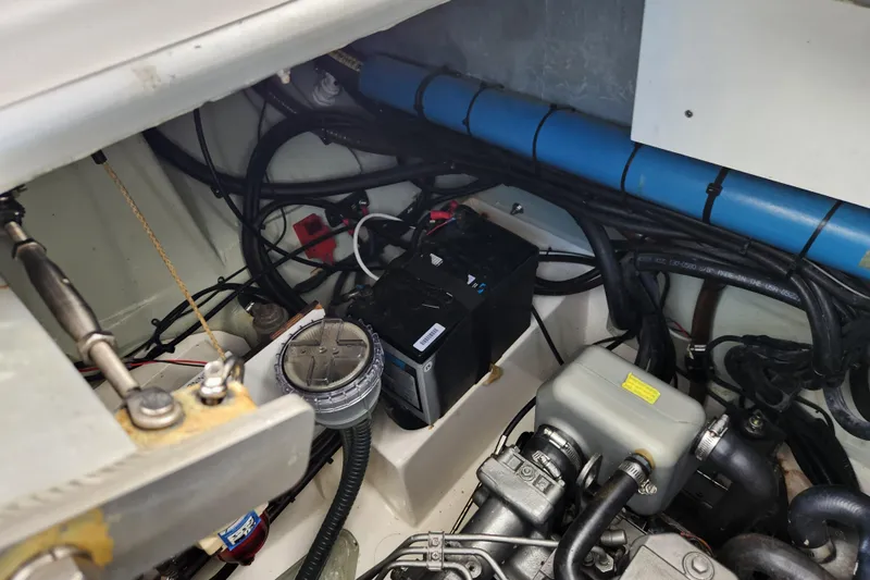 Cara Lynn Yacht Photos Pics Engine compartment of a 2015 Leopard 44 boat, featuring battery and wiring.