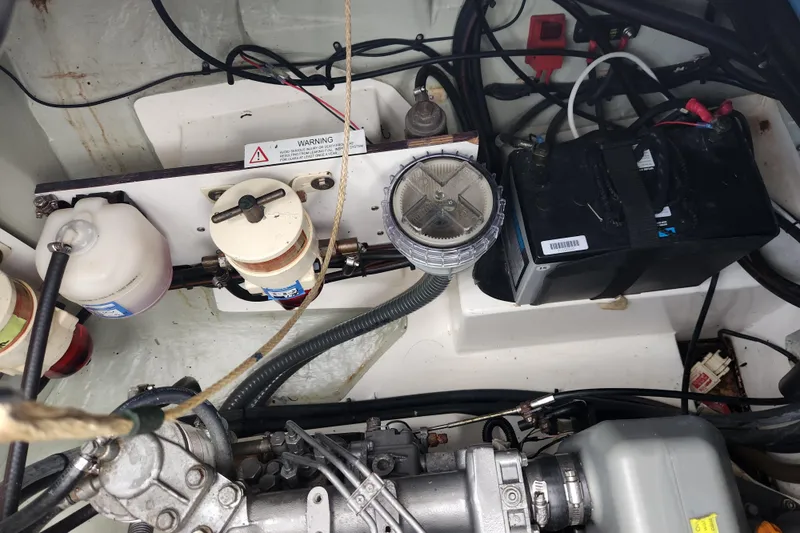Cara Lynn Yacht Photos Pics Engine compartment of a 2015 Leopard 44 yacht, featuring filters and battery components.