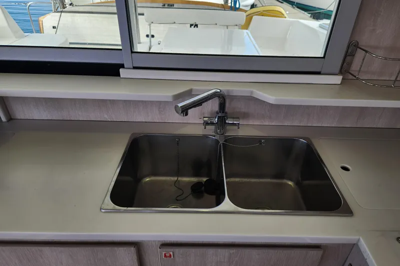 Cara Lynn Yacht Photos Pics 2015 Leopard 44 yacht kitchen sink with dual basins and modern faucet.