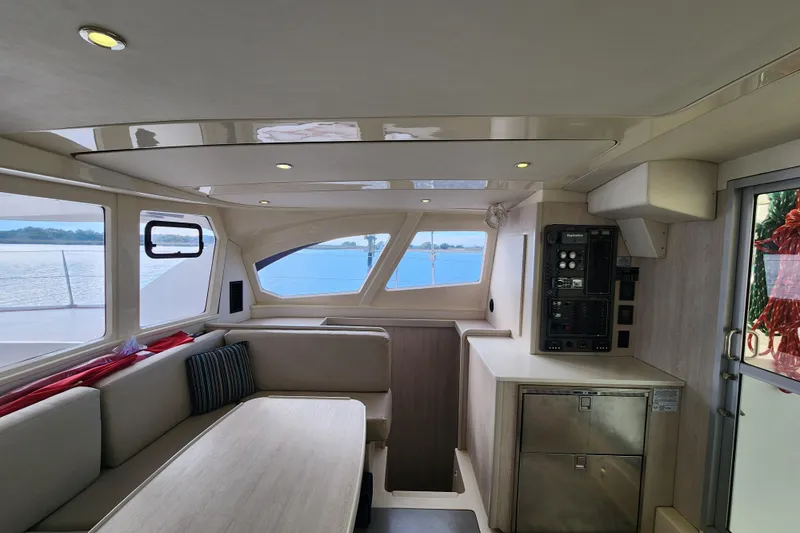 Cara Lynn Yacht Photos Pics Interior of 2015 Leopard 44 catamaran with modern seating and control panel.