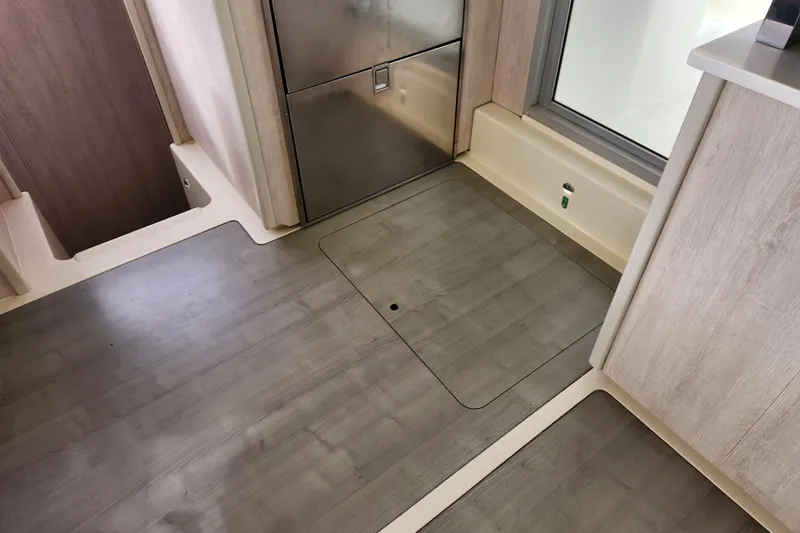 Cara Lynn Yacht Photos Pics Interior of 2015 Leopard 44 yacht with sleek wooden flooring and modern design.