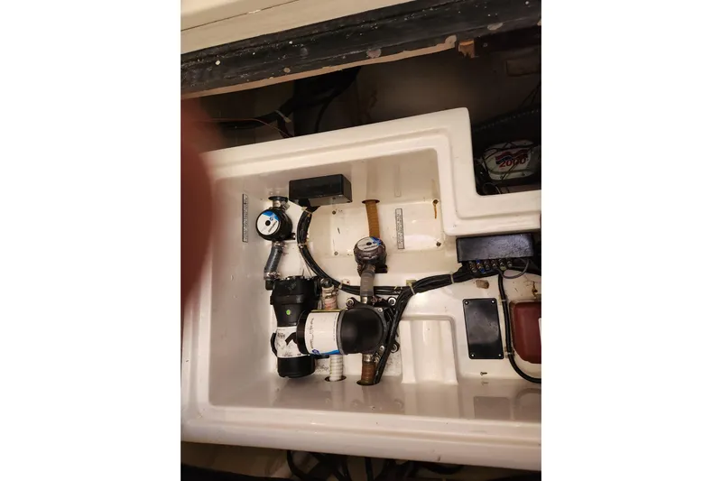 Cara Lynn Yacht Photos Pics Engine compartment of a 2015 Leopard 44 boat, showcasing mechanical components and wiring.