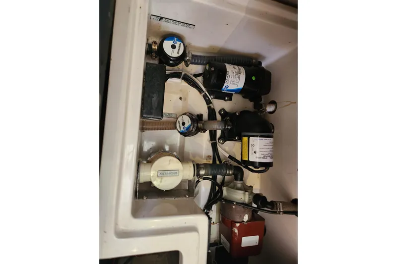 Cara Lynn Yacht Photos Pics Engine compartment of a 2015 Leopard 44, showcasing various mechanical components and wiring.