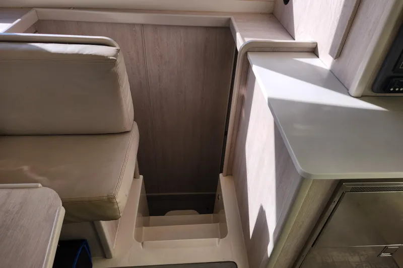 Cara Lynn Yacht Photos Pics Interior of a 2015 Leopard 44 yacht showing seating and stairs.