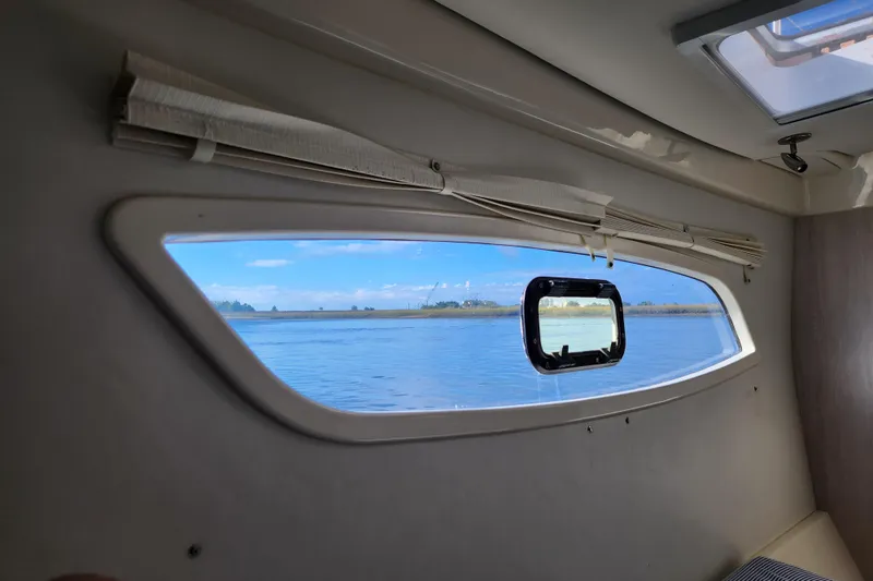 Cara Lynn Yacht Photos Pics Interior view from a 2015 Leopard 44 yacht, showcasing a scenic waterway through the window.