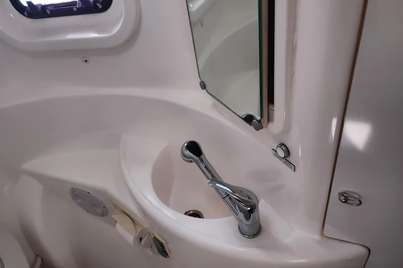 Cara Lynn Yacht Photos Pics Compact bathroom sink and mirror in 2015 Leopard 44 yacht.