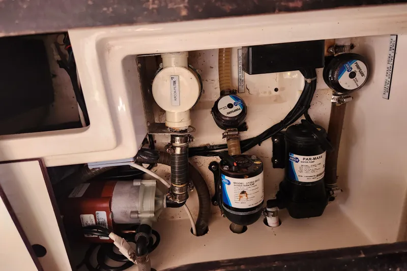 Cara Lynn Yacht Photos Pics Engine compartment of a 2015 Leopard 44 yacht with various mechanical components.