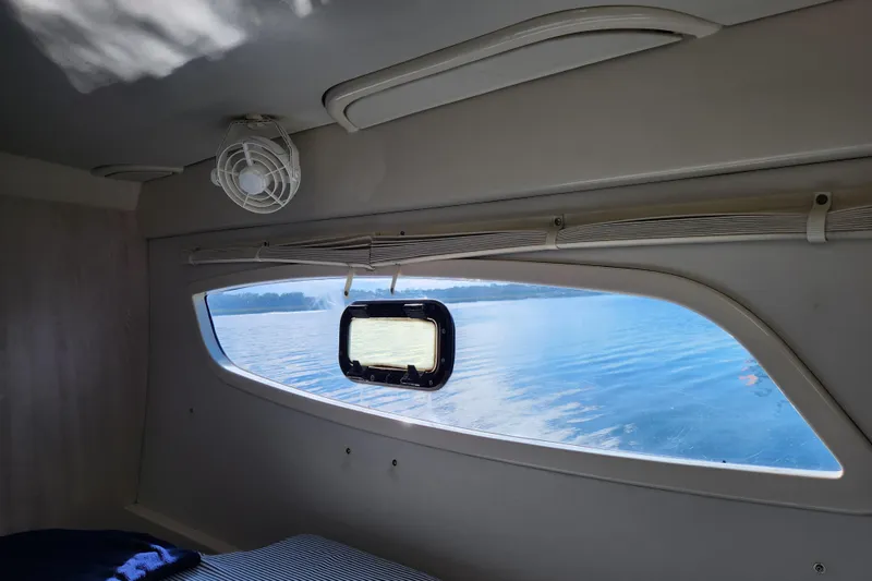 Cara Lynn Yacht Photos Pics Interior view of a 2015 Leopard 44 yacht cabin with ocean scenery through the window.