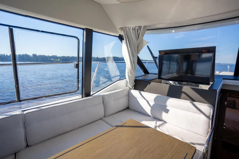 Samadhi Yacht Photos Pics Interior of 2024 Jeanneau NC 1295 Fly yacht with scenic water view.