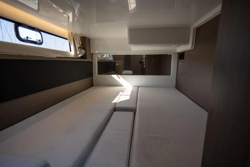 Samadhi Yacht Photos Pics 2024 Jeanneau NC 1295 Fly cabin interior with modern design and comfortable bedding.