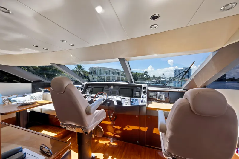 Oasis Yacht Photos Pics Luxurious helm of 2010 Princess 95 Motor Yacht with panoramic windows and plush seating.