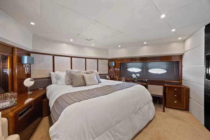 Oasis Yacht Photos Pics Luxurious bedroom interior of 2010 Princess 95 Motor Yacht with elegant decor and ambient lighting.