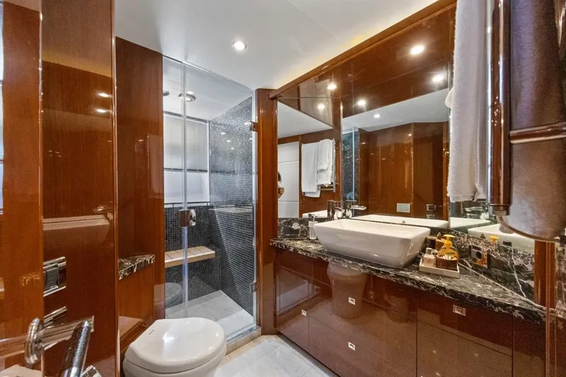 Oasis Yacht Photos Pics Luxurious bathroom on 2010 Princess 95 Motor Yacht with elegant wood and marble finishes.