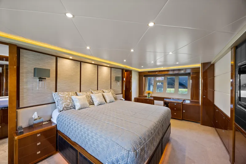 Oasis Yacht Photos Pics Luxurious bedroom interior of 2010 Princess 95 Motor Yacht with elegant decor and ample lighting.