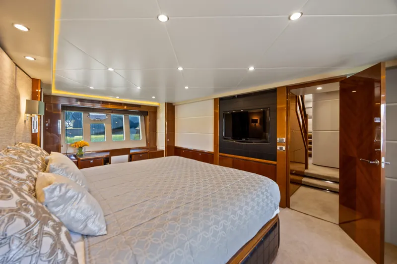 Oasis Yacht Photos Pics Luxurious bedroom interior of 2010 Princess 95 Motor Yacht with elegant decor and modern amenities.