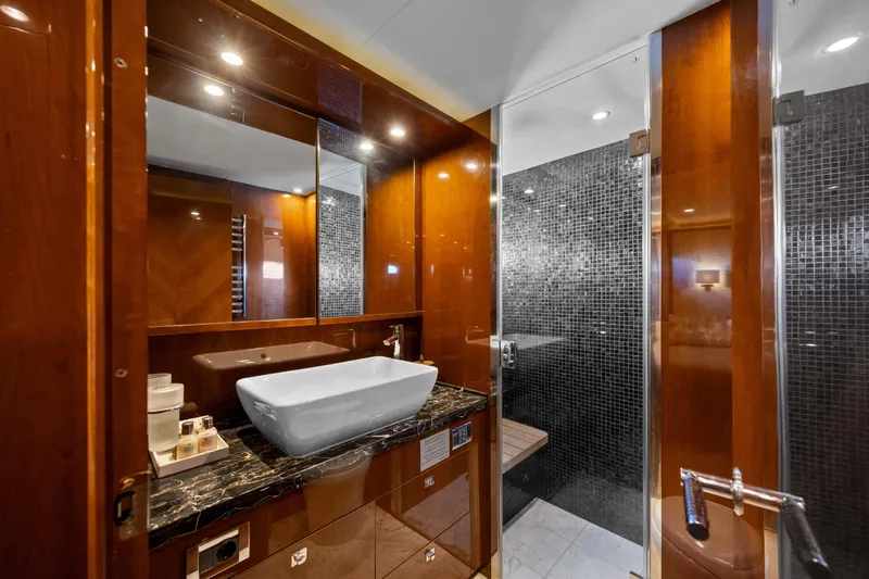 Oasis Yacht Photos Pics Luxurious bathroom on 2010 Princess 95 Motor Yacht with elegant wood and marble finishes.