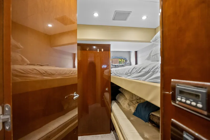 Oasis Yacht Photos Pics Luxurious cabin with bunk beds in a 2010 Princess 95 Motor Yacht.